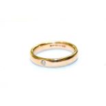 A 9 carat gold diamond band ring, finger size N. Gross weight 3.8 grams.