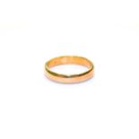 A 22 carat gold band ring, finger size U. Gross weight
