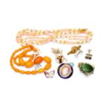 A small quantity of jewellery including a faux amber necklace, enamel brooches (a.f.), a pair of