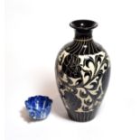 A Chinese Tz'u chou style vase and a small Chinese blue and white leaf form cup (2)