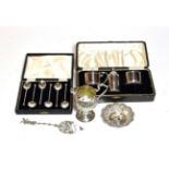 A collection of silver including a George III cream-jug, a cased Art Deco style condiment-set, a