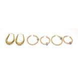 Three pairs of 9 carat gold hoop earrings, various designs . Gross weight 9.94 grams.