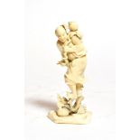 A Japanese ivory Okimono of a man holding a flower, circa 1900