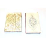 An ivory card-case, oblong, the cover carved with flowers and a butterfly, the base plain opens to