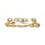 A fancy link bracelet, indistinctly marked, length 21cm, four 9 carat gold band rings, of various