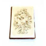 A carved Ivory card-case/aid-memoire, second half 19th century, oblong, the cover carved in high