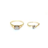 An 18 carat gold diamond solitaire ring, finger size T and an 18 carat gold diamond two stone
