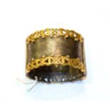 A silver, gilt and diamond hinged bangle. Gross weight 119.1 grams.