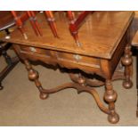 A reproduction oak side table in the 17th century style