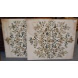 A pair of embroidered silk work panels depicting scrolling floral sprigs on a cream silk background,