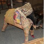 A 20th century Indian fabric covered and stuffed figure in the form of an Elephant with various