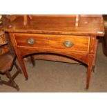 A George III mahogany side table (adapted) the single drawer raised on castors, 98cm wide by 35cm