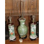 A pair of Chinese Famille verte sleeve vases, converted in to lamps and another celadon glaze