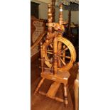 A turned spinning wheel labelled Keith Judy, Hadfield