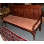 A late George III oak and mahogany and crossbanded settle with later seat and squab cushion