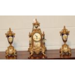 A German gilt metal and porcelain clock garniture, 20th century