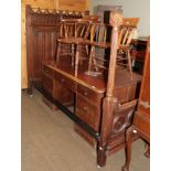 A Gothic Revival oak bedstead with linen fold carved headboard and Gothic tracery carvings,