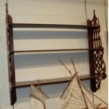 A mahogany fret-carved hanging set of three shelves, 91cm high by 93cm wide