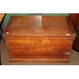 A brass bound oak chest with hinged lid