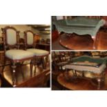 A pair of late 19th/early 20th century upholstered chair on fluted legs, a small scroll end sofa