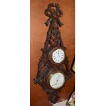 A late Victorian carved wood aneroid/thermometer combined timepiece, retailed by Cain, Halifax