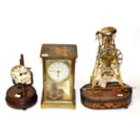 A 19th century brass skeleton timepiece on inlaid rosewood stand together with an electric eight