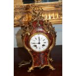 A gilt metal mounted and boulle inlaid striking mantle clock, signed to enamel dial Leeds