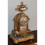 A French late 19th century gilt metal porcelain mounted striking mantel clock, twin barrel movement,