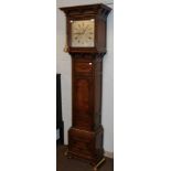 An Edwardian oak carved eight-day long case clock, silver dial signed Maple. London, double weight