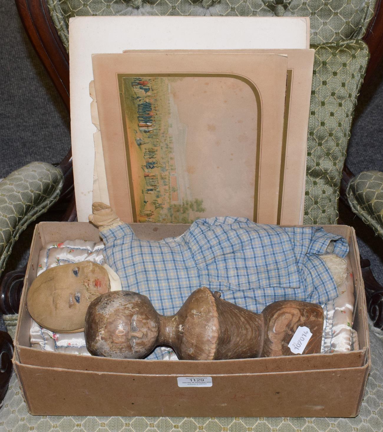 A wooden antique doll head and torso, 26.5cm high and a fabric doll in box together with Le Blond