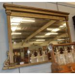 A late 19th century gilt over mantle mirror with bevel glass plate