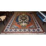 Kozak Anatolian carpet, indigo field with an ivory medallion enclosed by ivory borders geometric