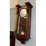 A walnut Vienna style striking wall clock