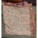 A late 19th century patchwork bed cover with cotton trim and floral reverse