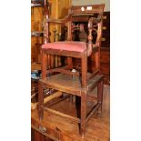 A 19th century child's high chair on stand