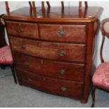 A Victorian mahogany bow fronted chest of drawers; a Victorian pine crib; a set of four Edwardian