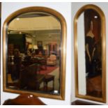 A gilt mirror with arch reeded frame and another (2)