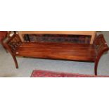 A reproduction hard wood double bench