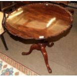 A mahogany tripod tilt-top occasional table