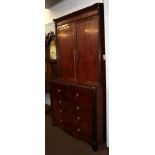 A Regency mahogany secretaire bookcase, early 19th century, the moulded cornice with fluted capitals