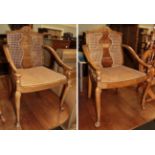 A pair of 1920's walnut bergere armchairs