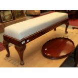 An Edwardian oval tray, a cane chair and a walnut footstool