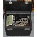 A Singer portable sewing machine No 221K1, together with accessories including the rubber mat (