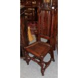 A late 17th century joint oak chair with solid seat and turned and blocked legs