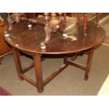 An 18th century and later oak drop leaf table, 137cm diameter