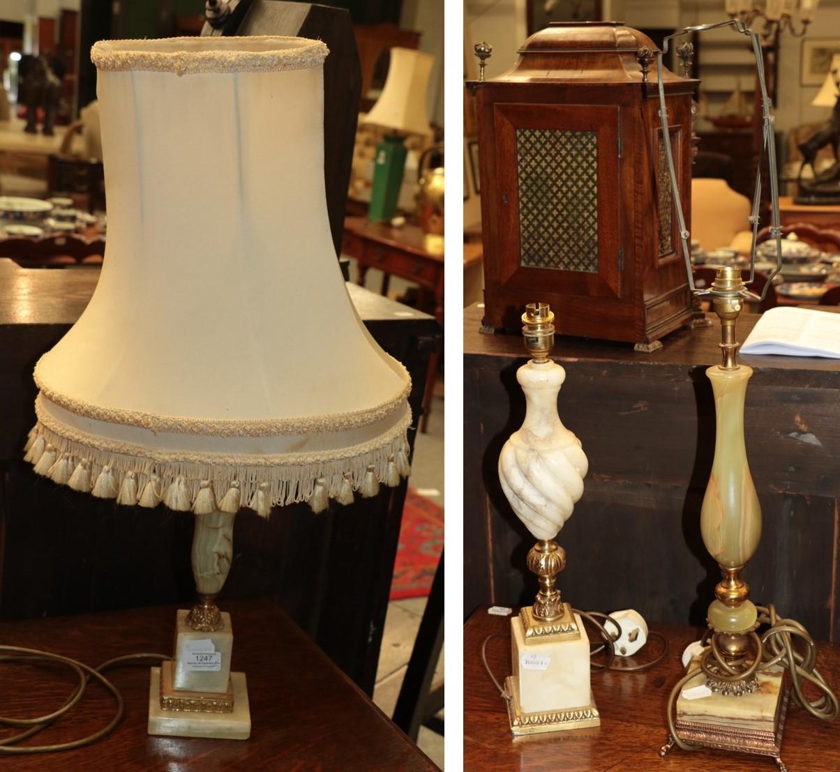 Three decorative lamps comprising a green onyx example with metal mounts, an alabaster urn shaped