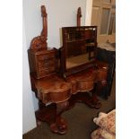 A Victorian walnut Duchess style dressing table (lacking mirror)