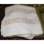 A large cotton patchwork quilt of recent date, the cream field with pink floral borders and