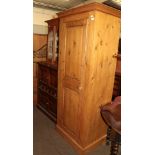 A single pine wardrobe, pine linen chest and a Victorian pine, glazed wall mounted cupboard and a