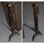 A pair of steel andirons, French, late 17th/18th century, in Medieval style with octagonal ball